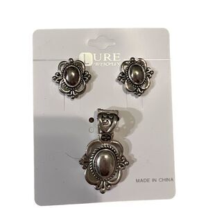 Silver pendant with matching pierced earrings.